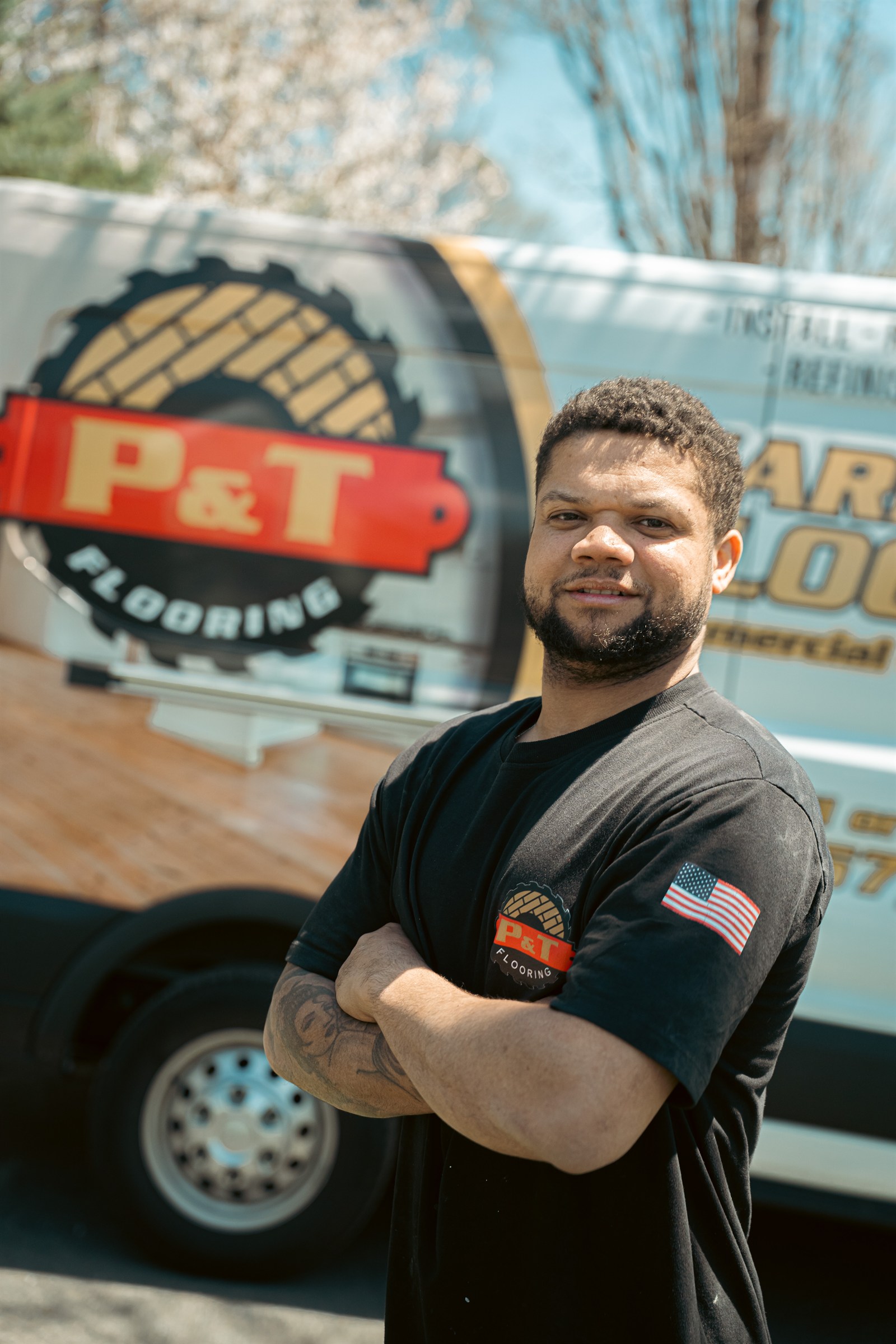 P&T Flooring crew member by the van